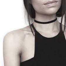 A black choker on the neck of a woman